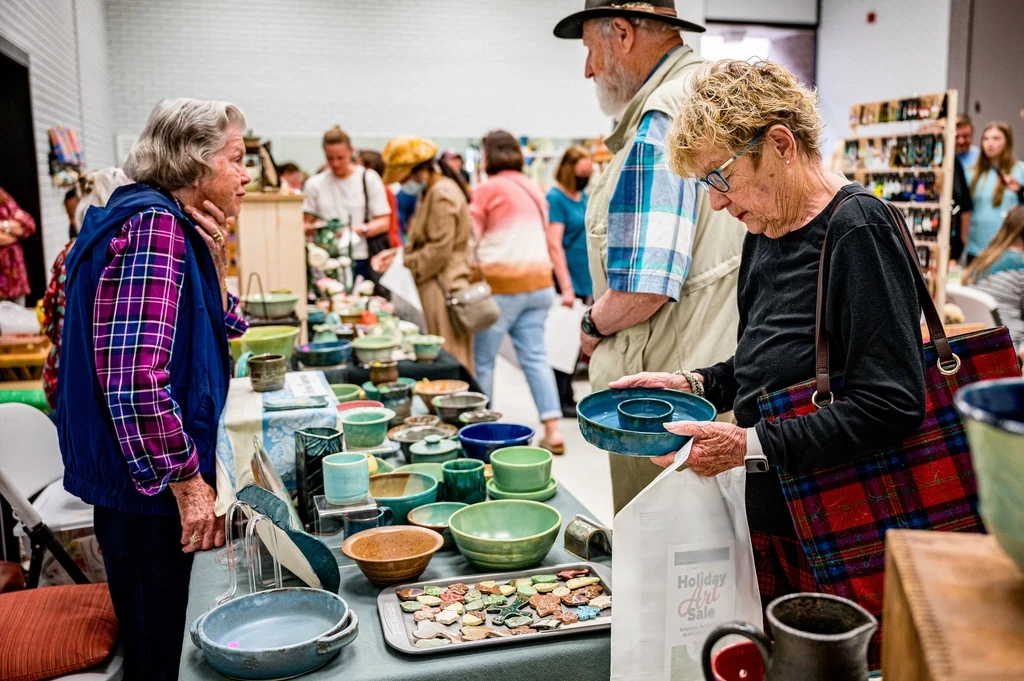 Etsy maker selling handmade goods at a market